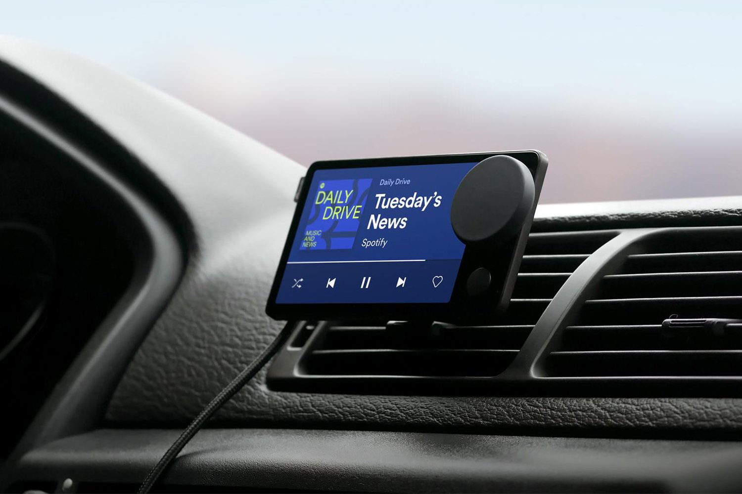 Spotify's new hardware device called Car Thing is mounted on a car dashboard