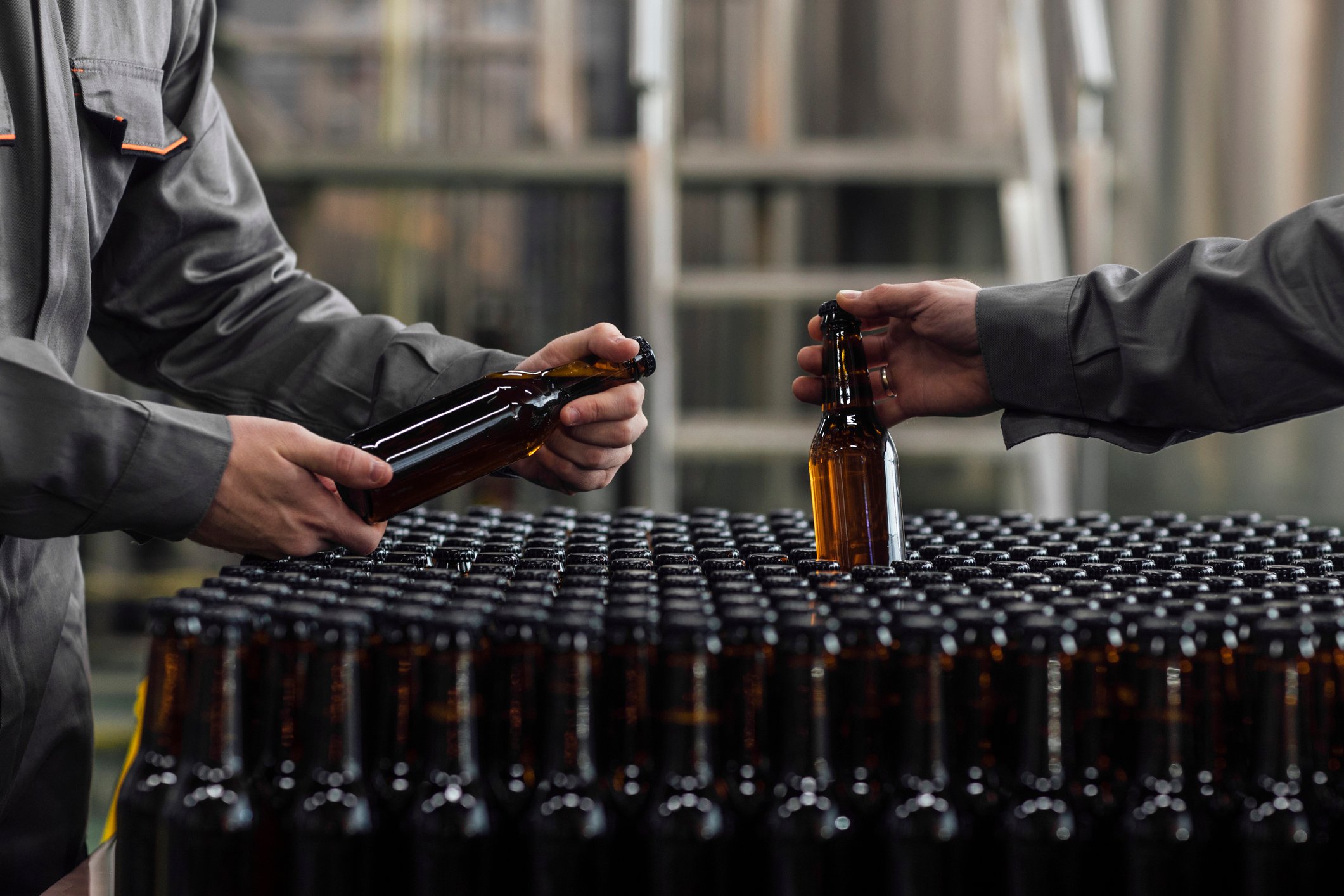 Bottles of unlabeled beer at a distribution center.