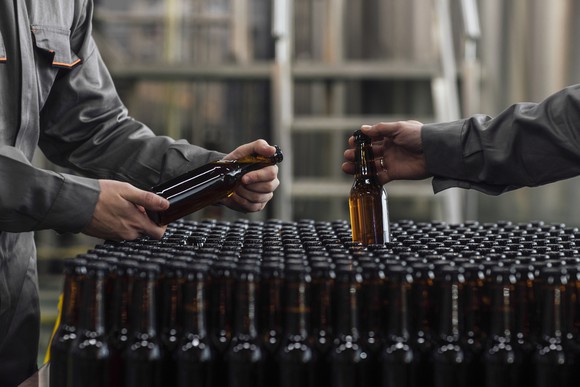 Bottles of unlabeled beer at a distribution center.