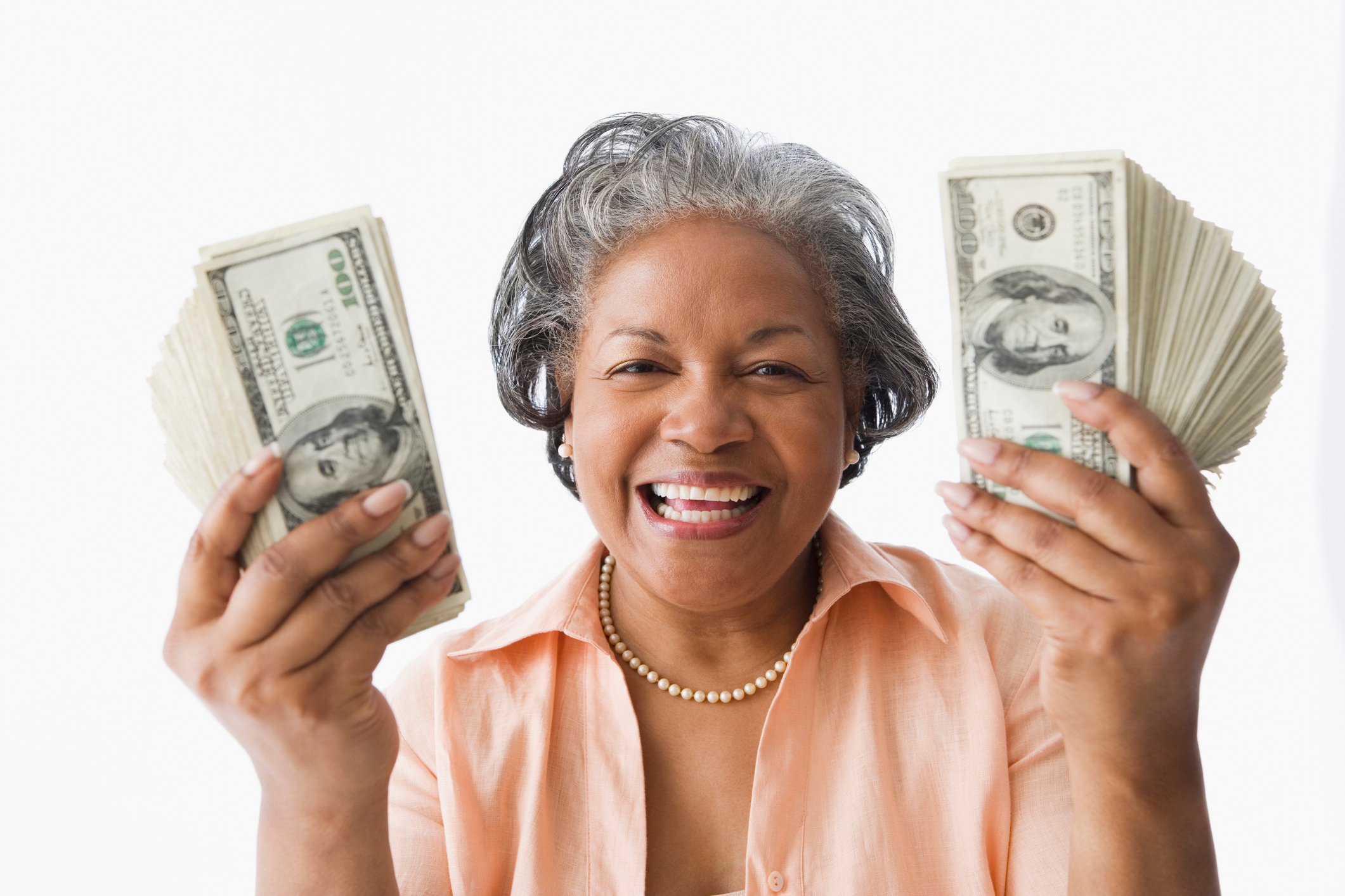 Older woman holding money. 