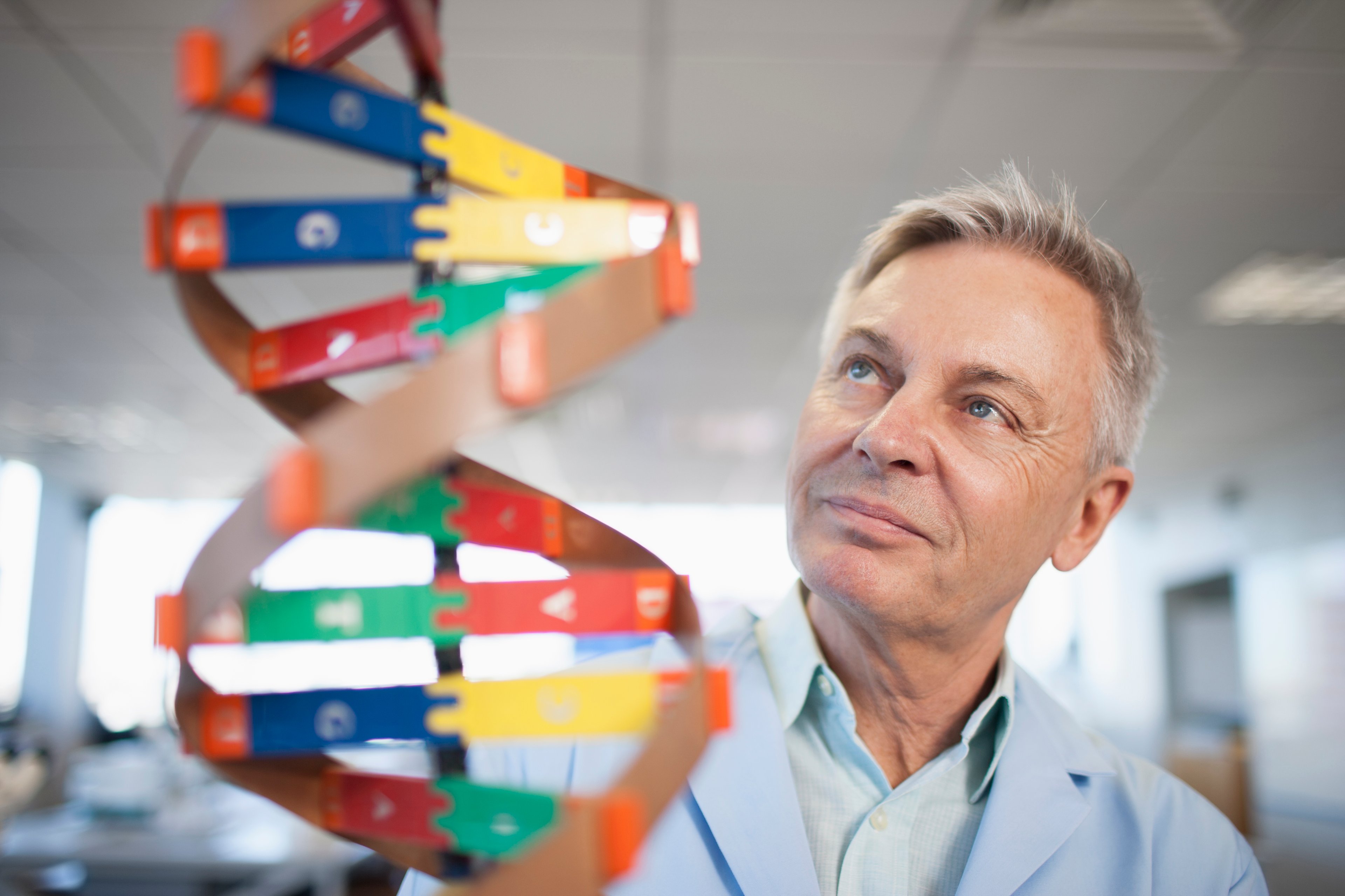 Researcher observing DNA strands. 