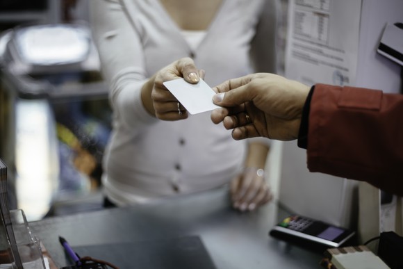 A customer and a merchant making a payment card transaction.