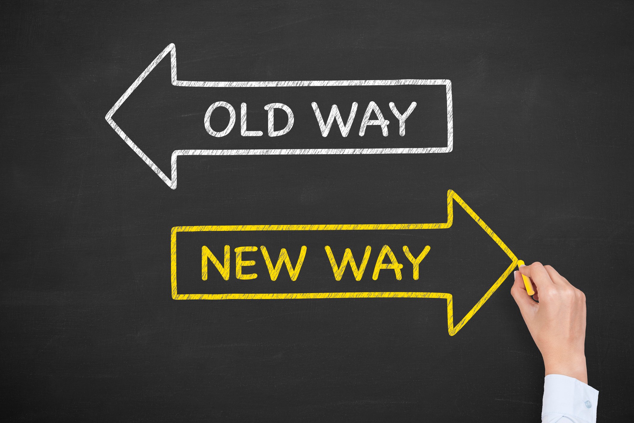 A white arrow labeled "old way" points left on a chalkboard. A yellow arrow labeled "new way" points right.