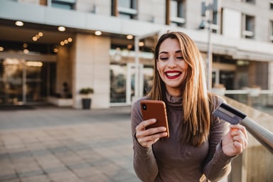 A woman paying with a mobile phone