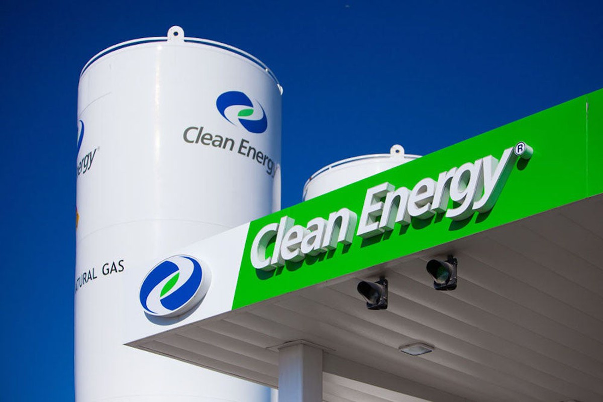 Awning with Clean Energy logo, with gas storage tank behind.