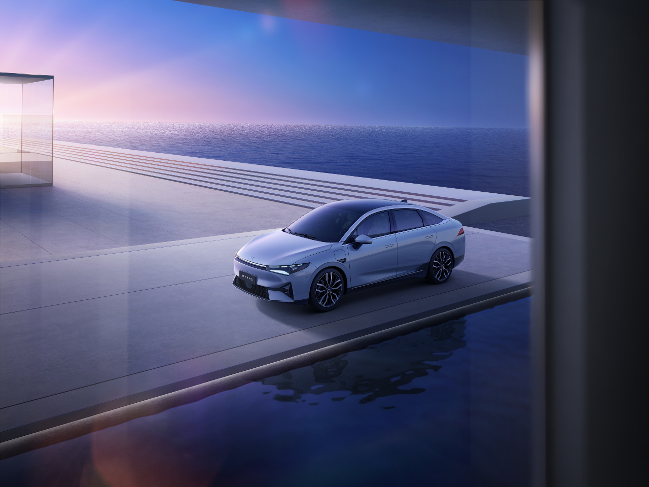 An Xpeng P5 on a platform with the ocean in the background. 