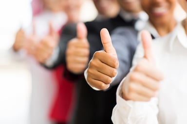 Smiling people with thumbs up