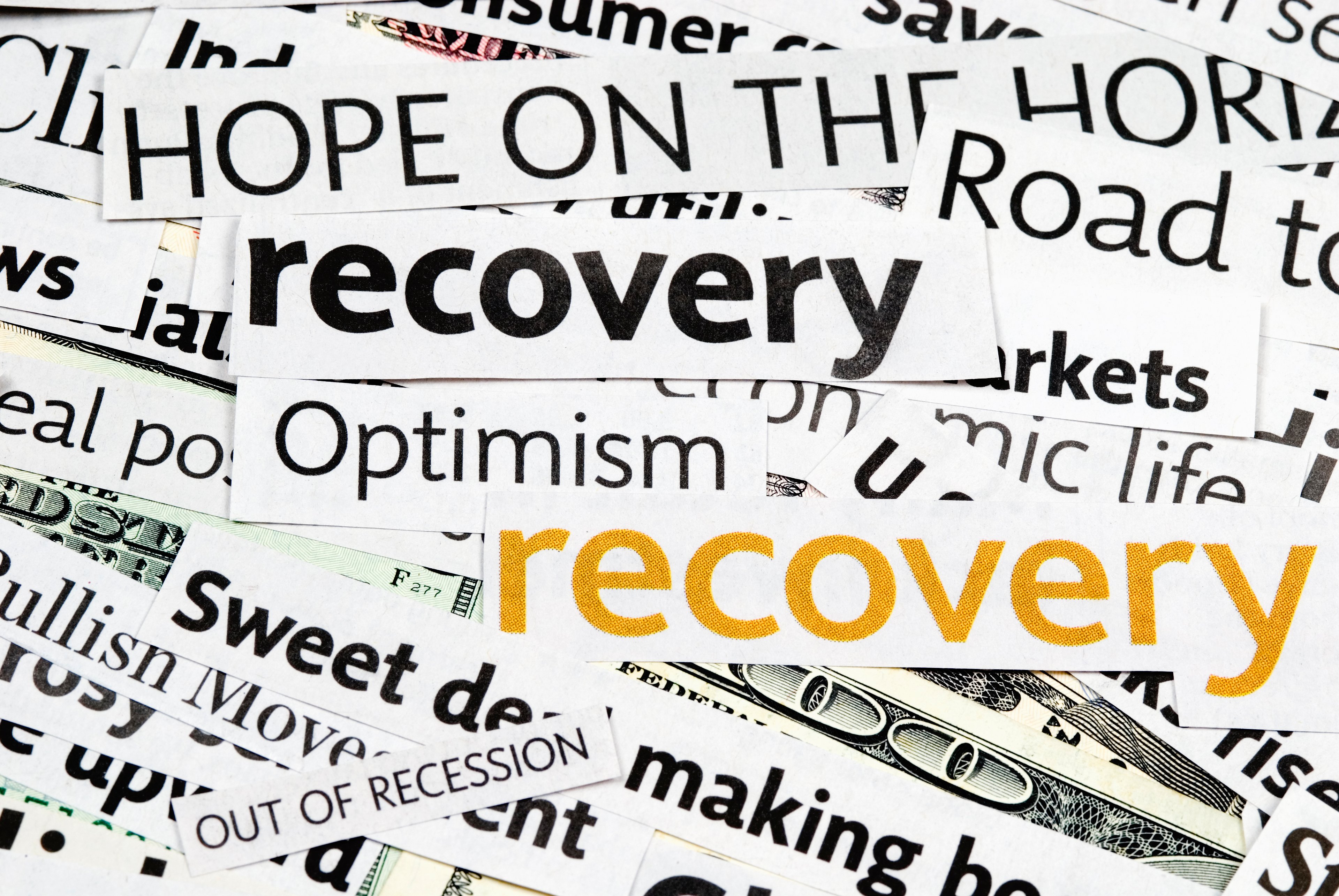 A collage of clippings from magazines including words like "recovery" and "optimism."
