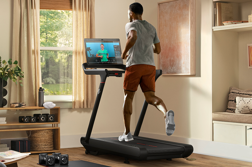 man at home on Peloton treadmill