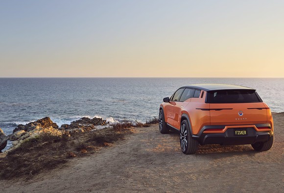 Fisker Ocean SUV parked on a cliff overlooking the ocean