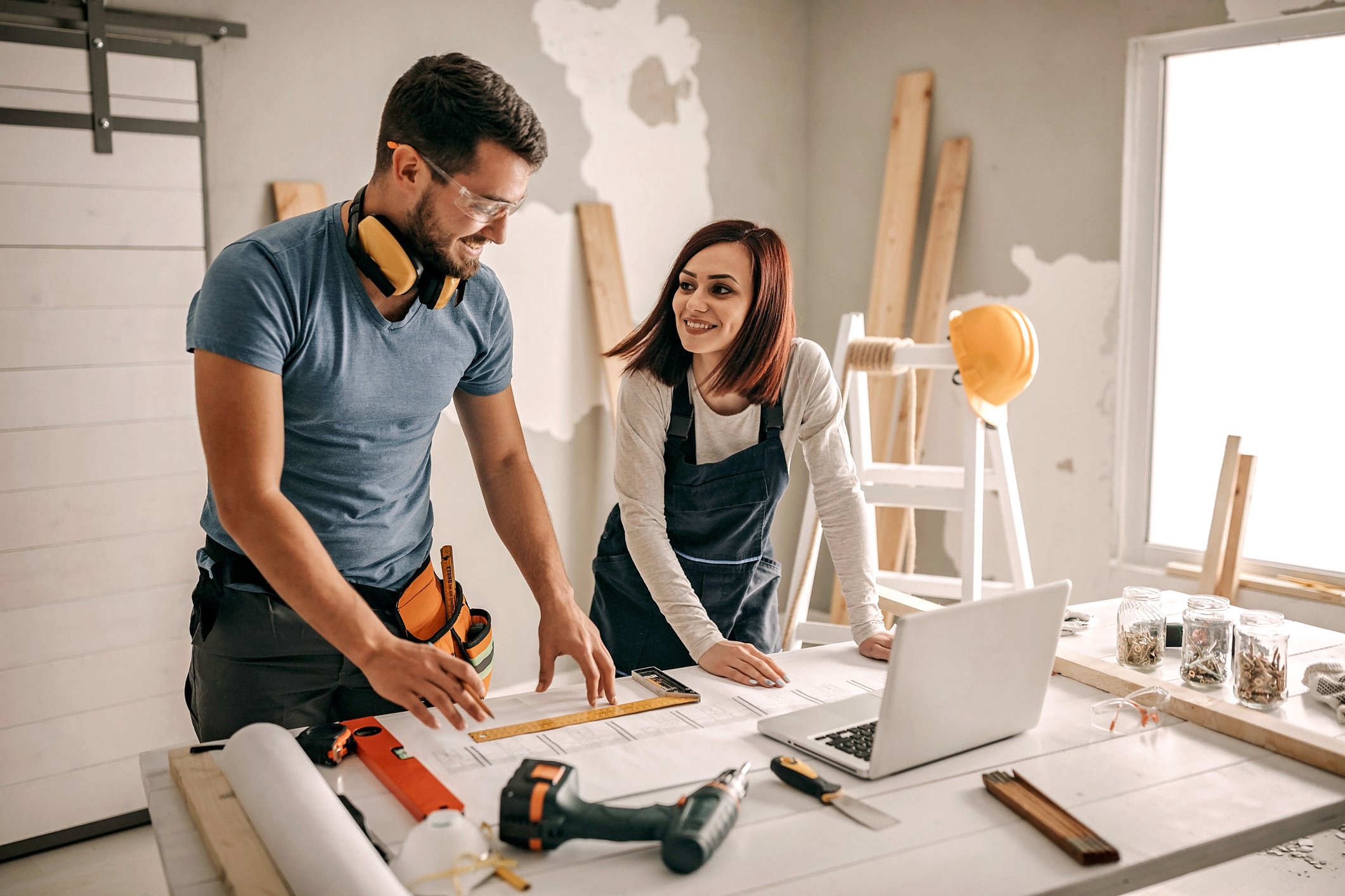 man and woman working on a home improvement project