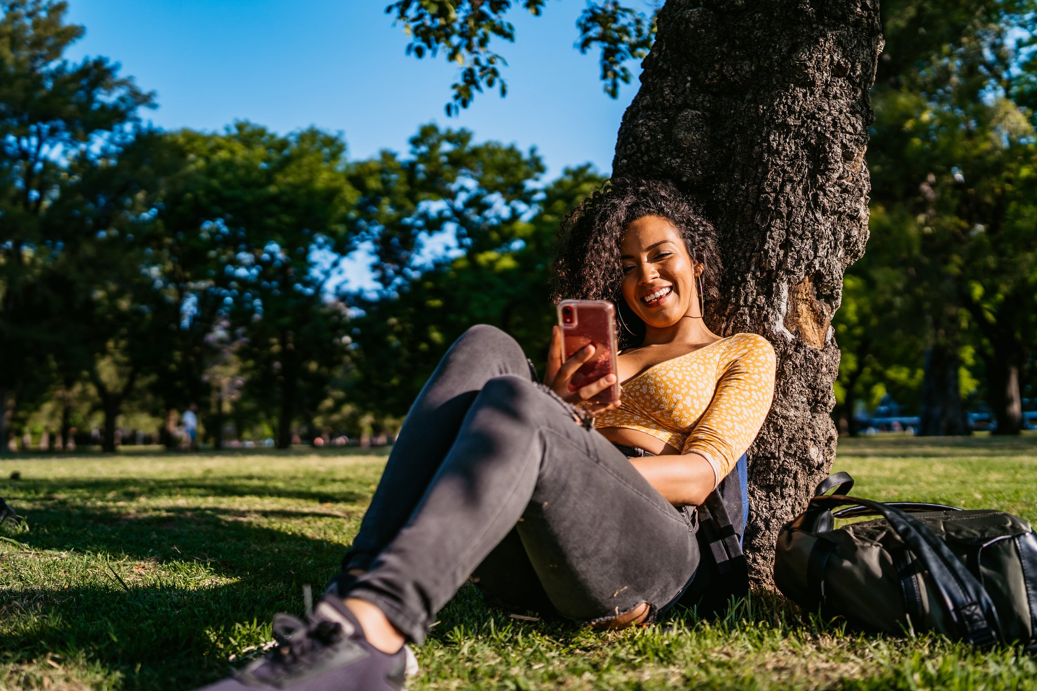 Woman using smartphone in park