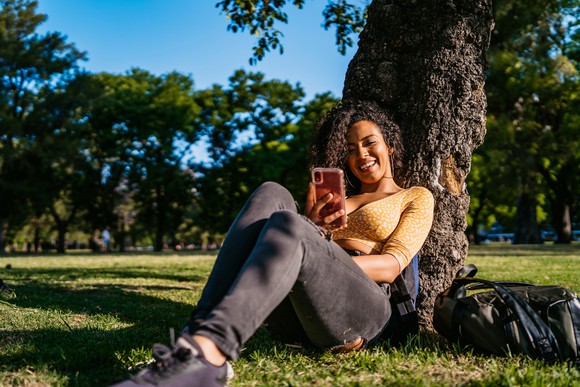 Woman using smartphone in park