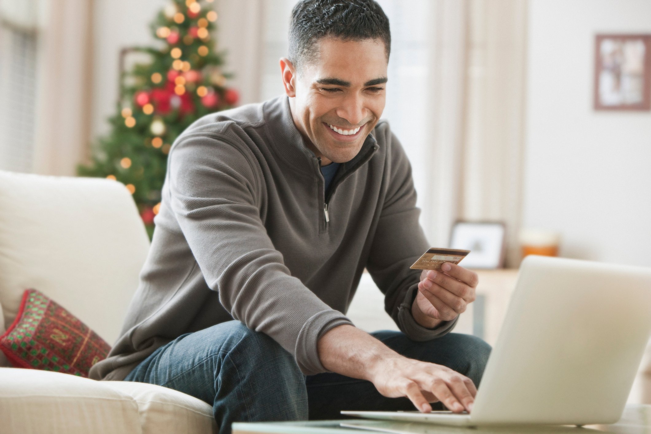 A man paying on his computer.