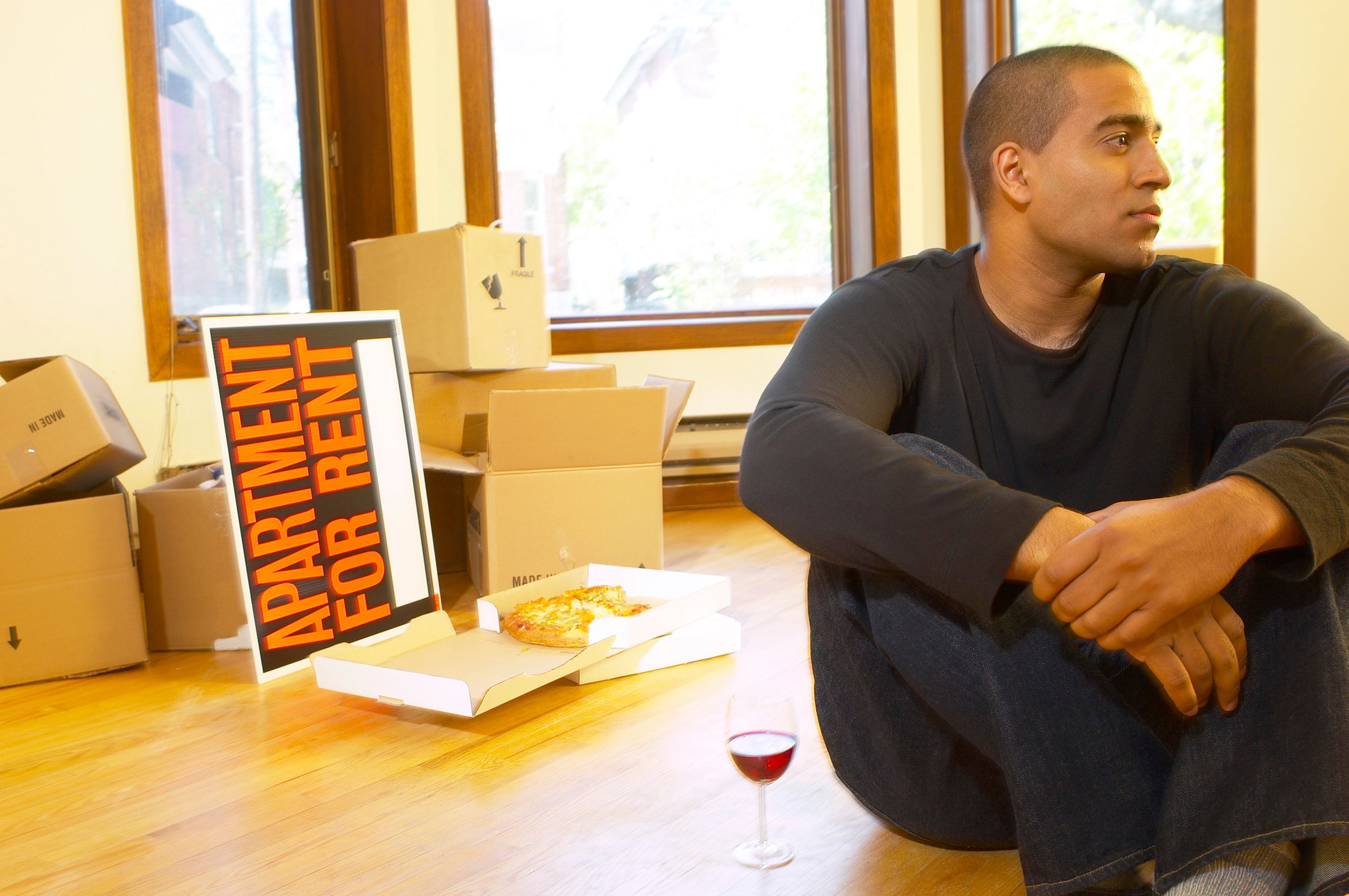 GettyImages-man moving into an apartment