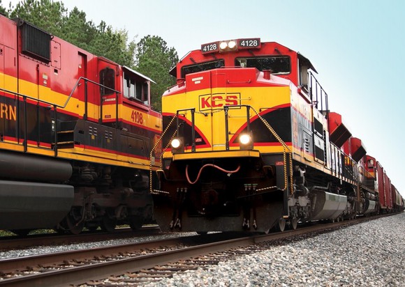 Two KSU trains pass on the rails.