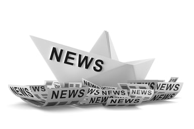 Paper boat reads NEWS