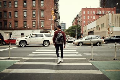GettyImages-pedestrian crossing a busy street