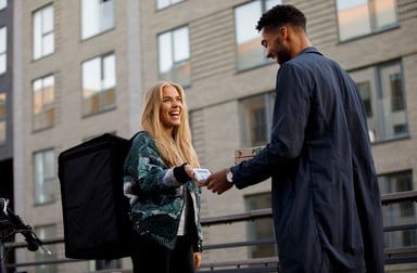 A person paying for a delivery