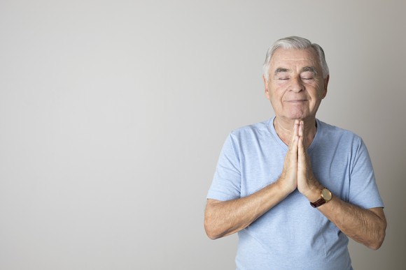 Retired man in peaceful meditation