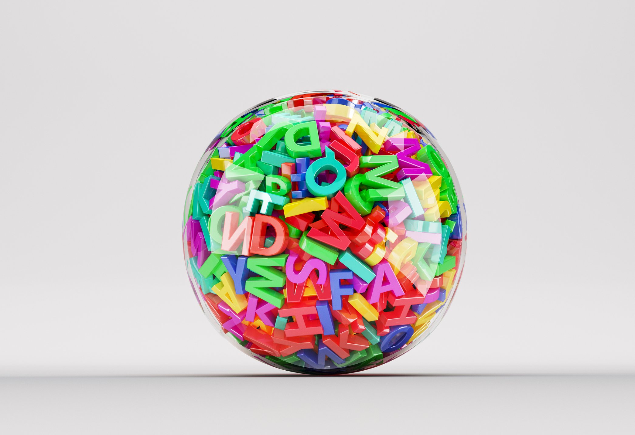 Clear ball filled with colorful letters of the alphabet.