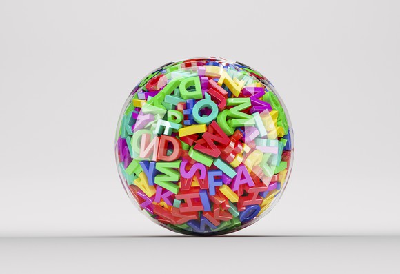 Clear ball filled with colorful letters of the alphabet.