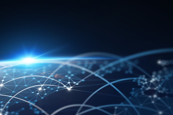 Close-up of globe with interconnected cities