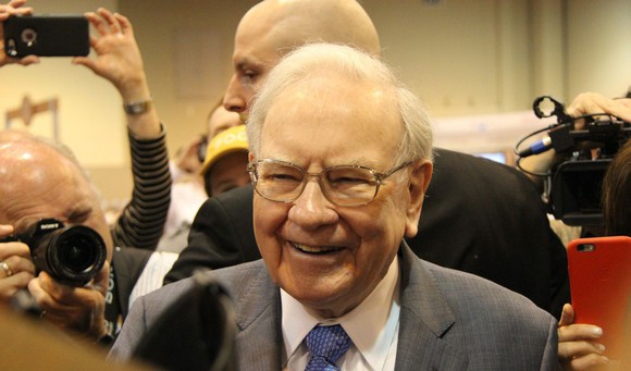 Warren Buffett smiling. 