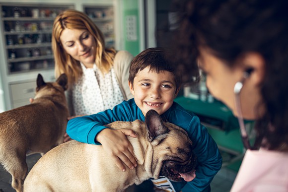 Family with dogs at the vet's office.