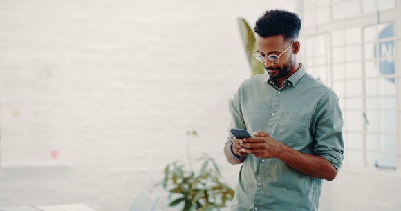 A man uses a smartphone.