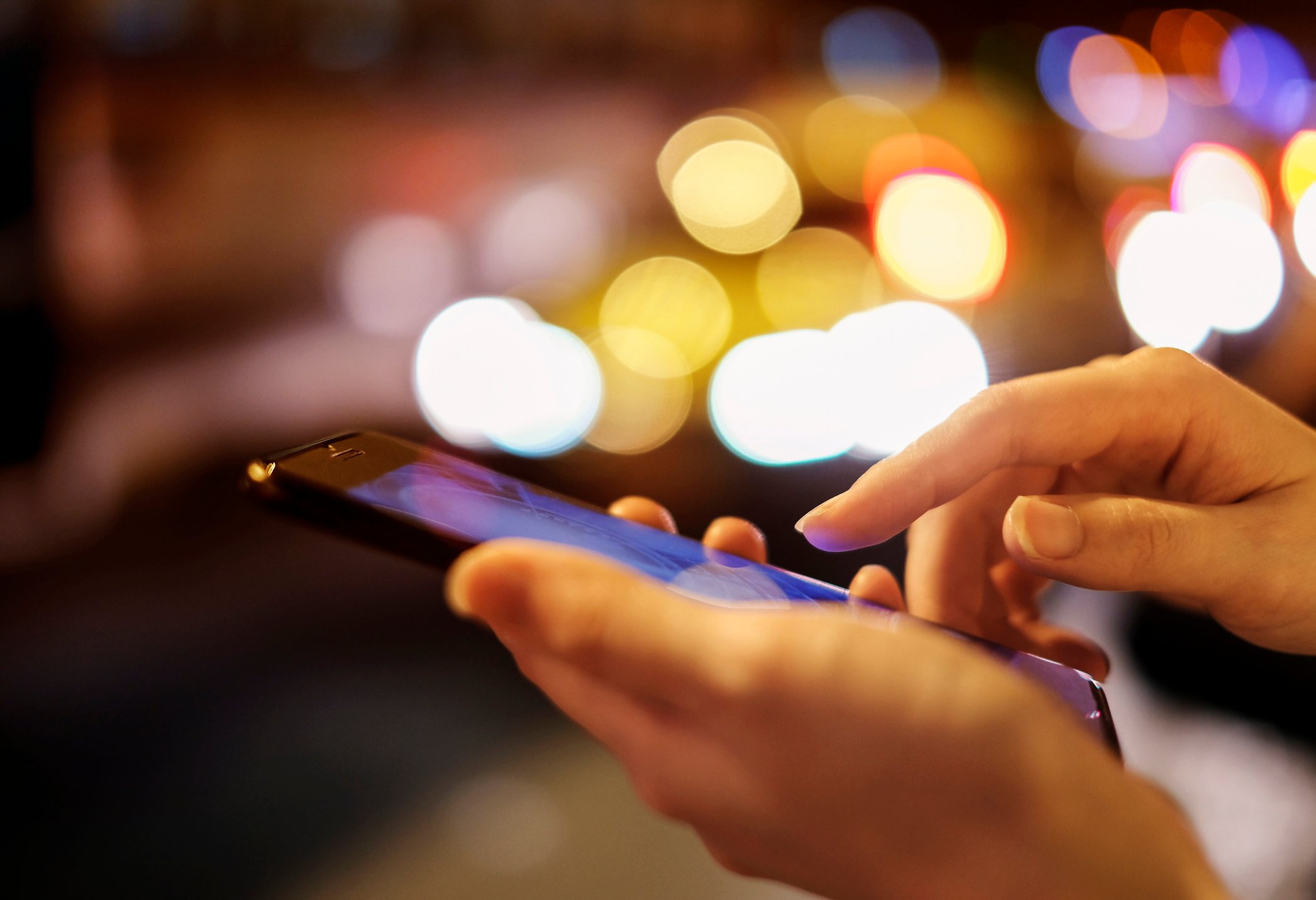 A person uses a smartphone.