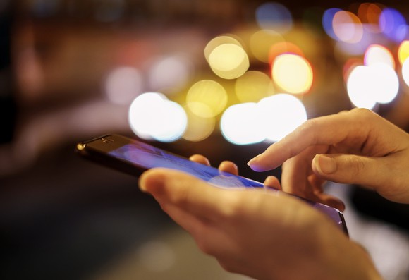 A person uses a smartphone.