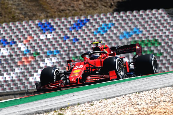 Carlos Sainz on track in a Ferrari racing car. 