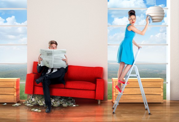 A couple in a home with cash under the sofa.