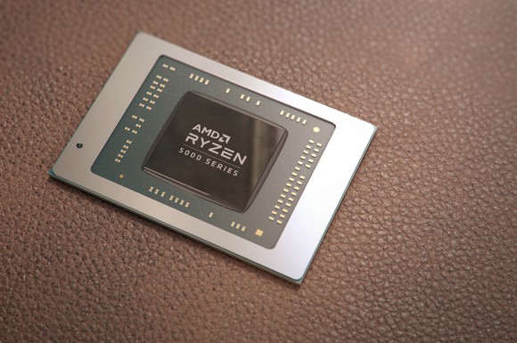 AMD's Ryzen 5000 Series chip is shown sitting on a table.