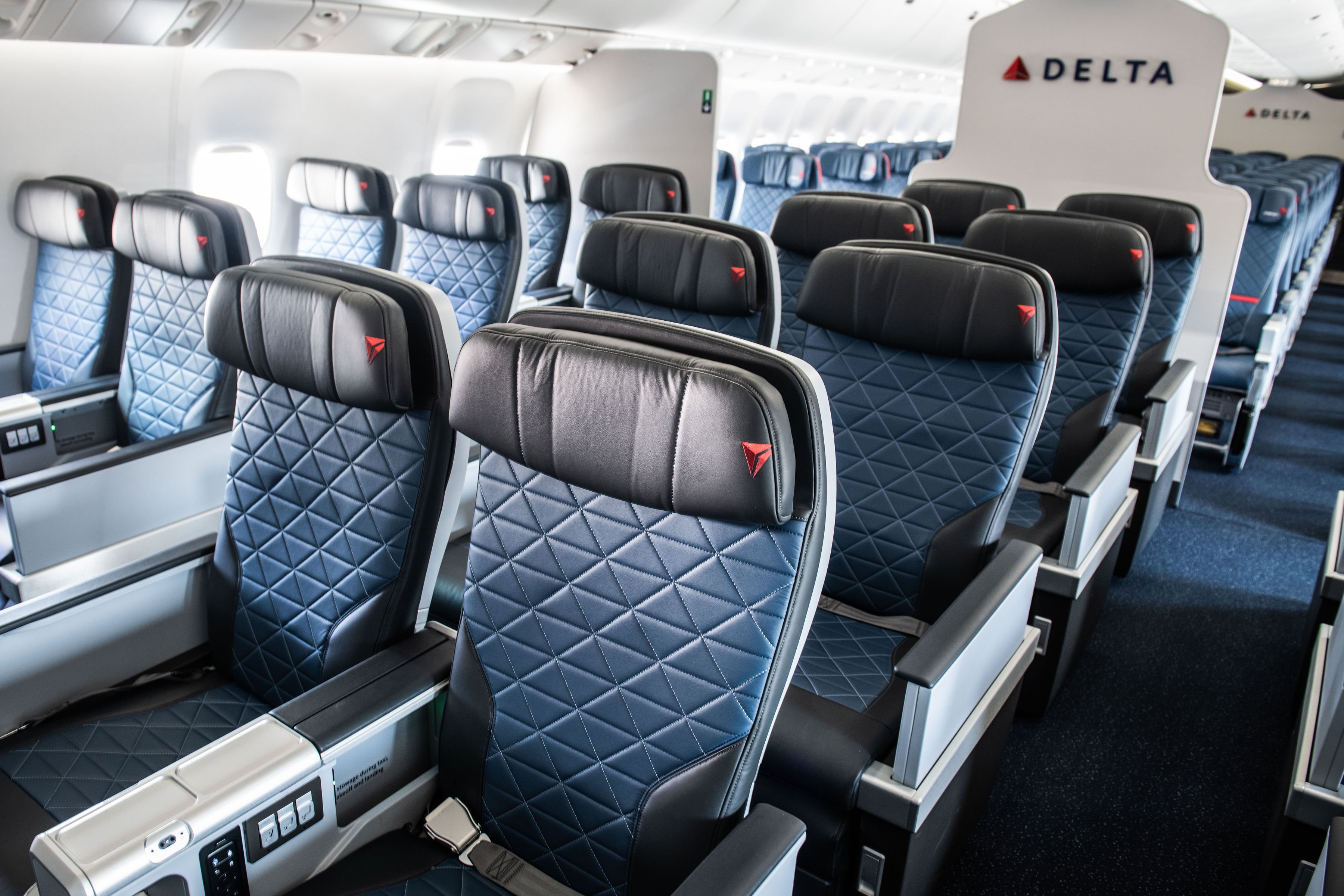 Four rows of premium select seats on a Delta Air Lines plane