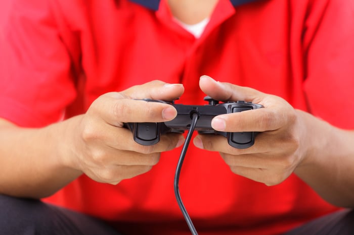 Person holding video-game controller