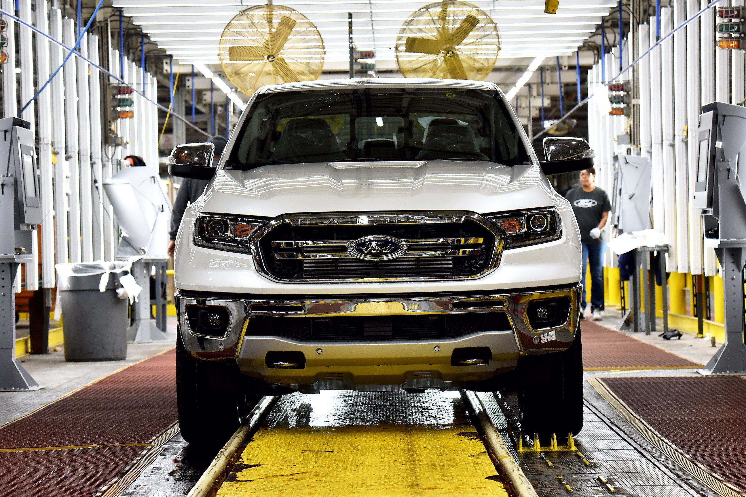 A white Ford Ranger pickup truck moves down the assembly line at Ford's Michigan Assembly Plant in Wayne, Michigan.