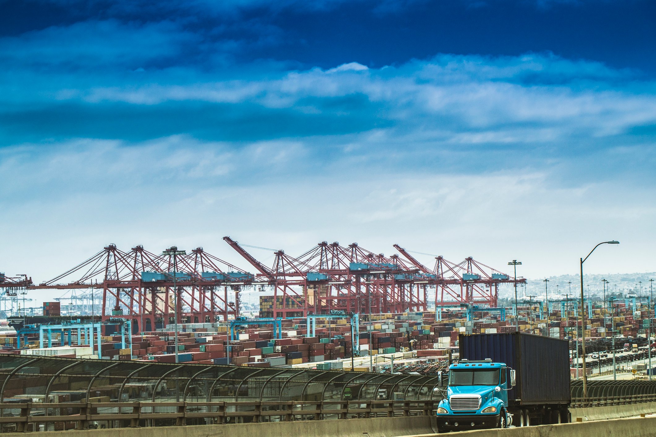 A truck drives away from the Port of Los Angeles.
