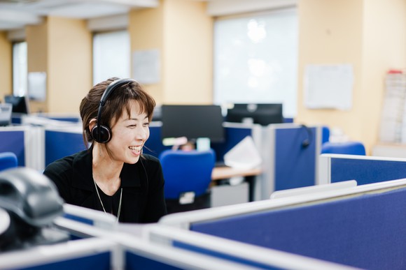 A woman working in a call center.
