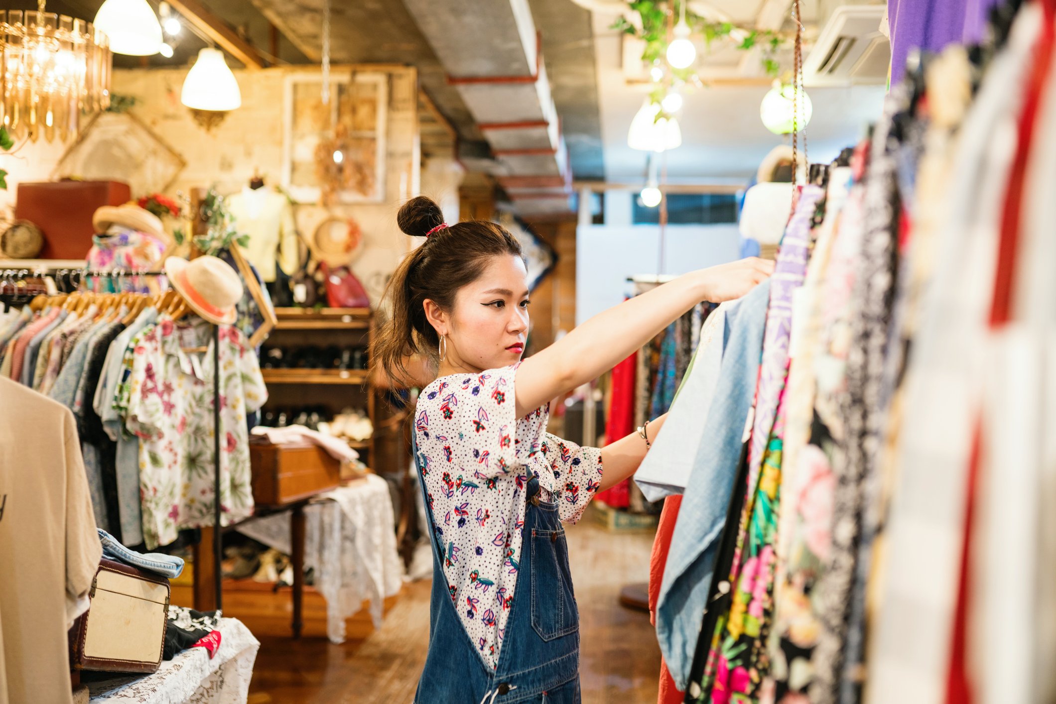 Woman looking at clothes in shop
