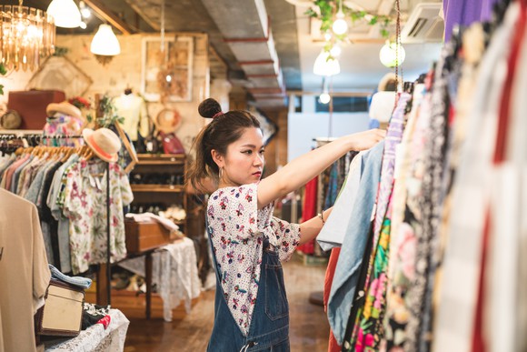 Woman looking at clothes in shop