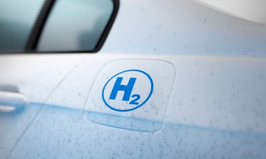 Close up of a white colored hydrogen powered car.
