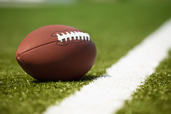 A football on a field.