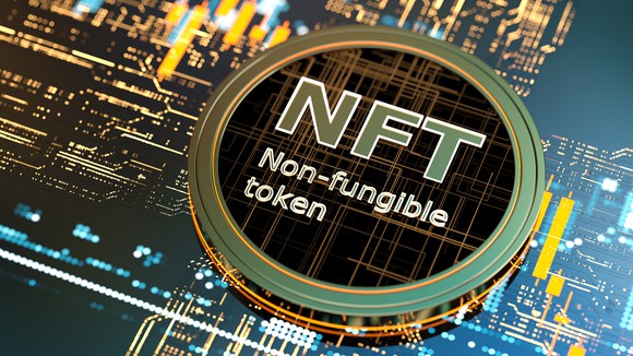 Circular token bearing the words: NFT Non-fungible token.