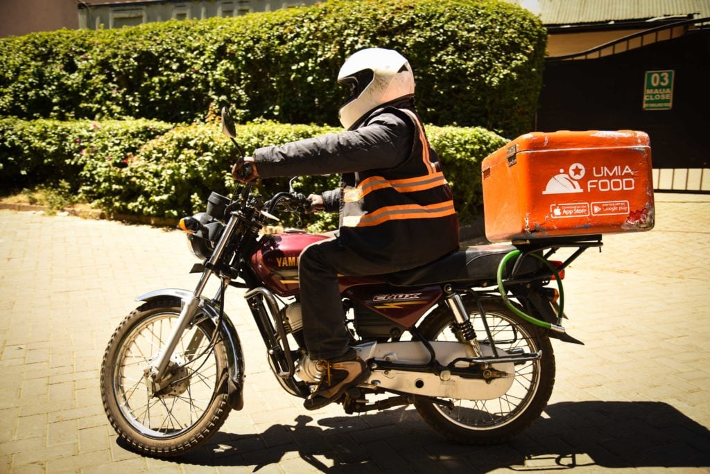 A Jumia delivery man on a motorbike.