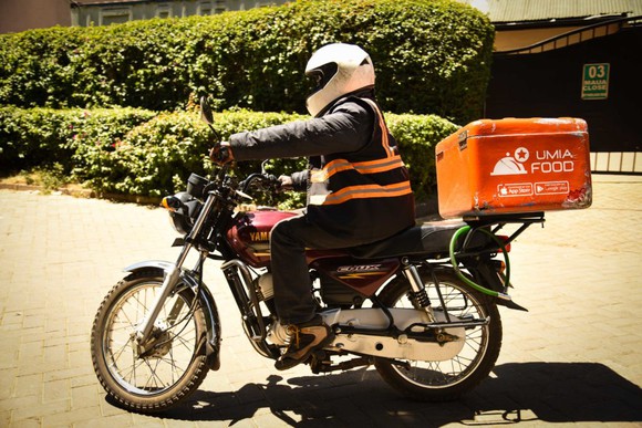 A Jumia delivery man on a motorbike.