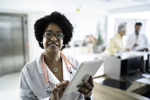 woman doctor tablet