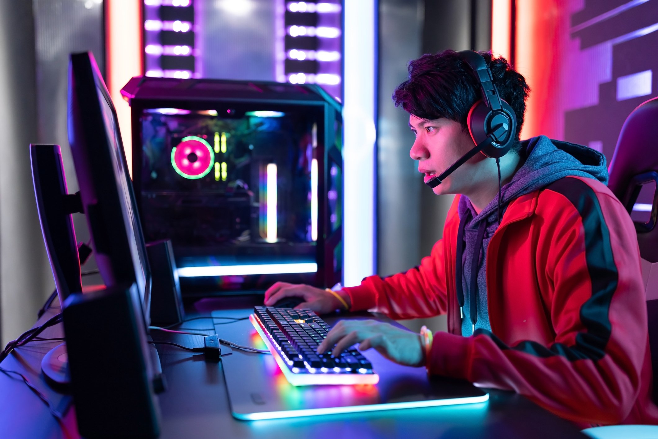 Man playing video game on a PC.