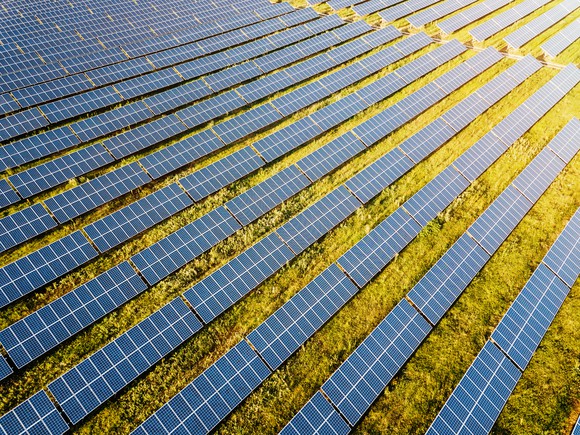 Large solar panel farm in a field